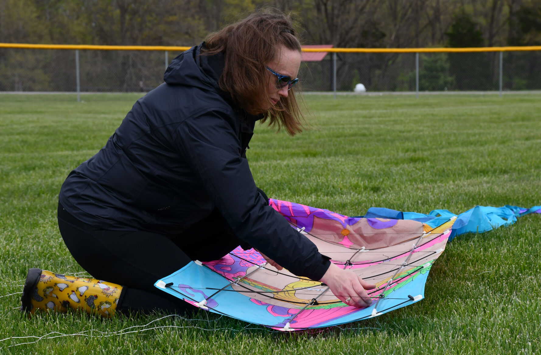 Donna Houchins assembles a kite